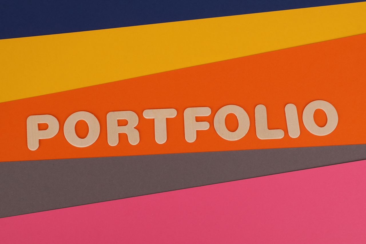about-img-01 A vibrant multicolored background featuring the text PORTFOLIO in pink font on colorful paper.